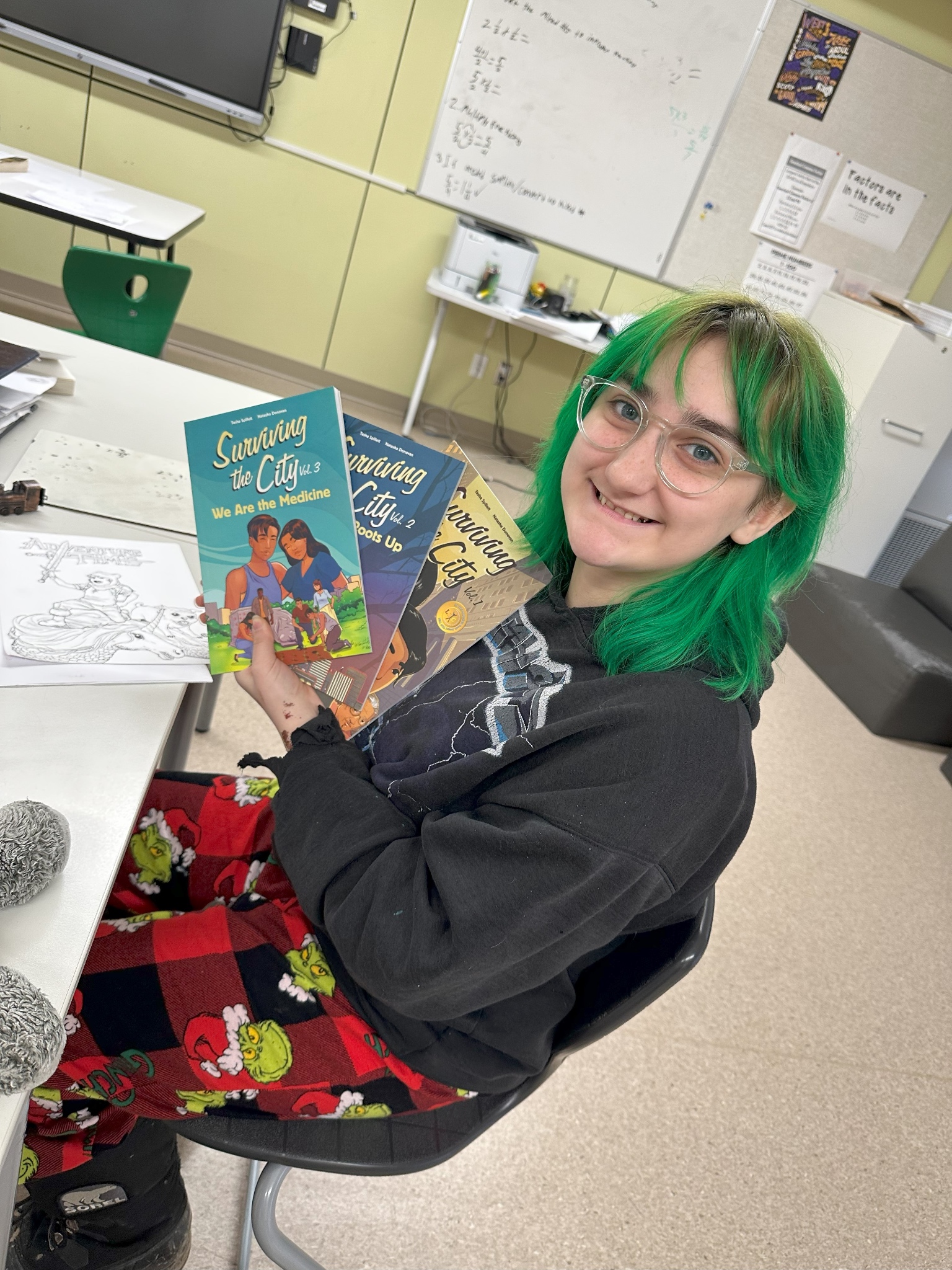 Proj Illustrator Asher with books smile